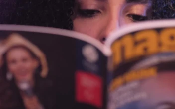Stock Video Look Of A Girl While She Reads A Magazine Animated Wallpaper