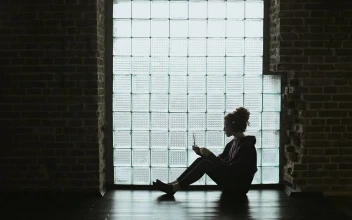 Stock Video Lonley Girl Sitting On Floor With Headphones Backlit By Window Animated Wallpaper