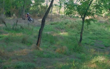 Stock Video Long Jump In The Bicycle On A Rural Road Animated Wallpaper
