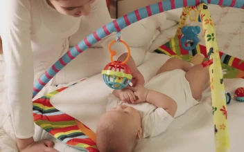 Stock Video Little Sister Plays With Her Baby Brother Animated Wallpaper