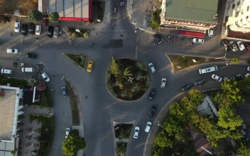 Stock Video Little Roundabout With Traffic Top Aerial View Animated Wallpaper