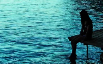Stock Video Little Girl Wetting Her Feet On The Pier Animated Wallpaper