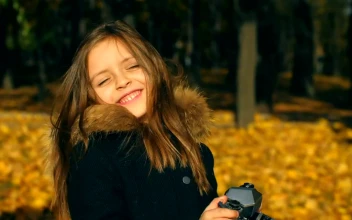 Stock Video Little Girl Taking Photos With A Camera Animated Wallpaper