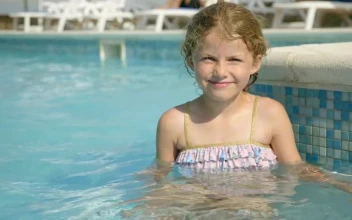 Stock Video Little Girl Sitting In Pool And Smiling Animated Wallpaper