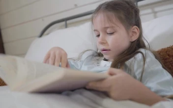 Stock Video Little Girl Reads A Story In A Book Animated Wallpaper