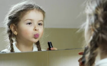 Stock Video Little Girl Puts On Lipstick In The Mirror Animated Wallpaper