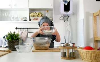 Stock Video Little Girl Preparing A Cookie Mix Animated Wallpaper