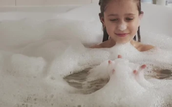 Stock Video Little Girl Plays With Foam In The Bathtub Animated Wallpaper