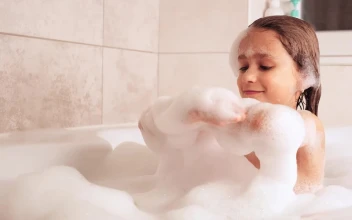 Stock Video Little Girl Plays While Taking A Bath Animated Wallpaper