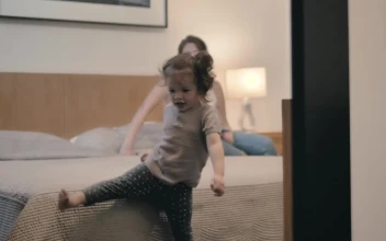 Stock Video Little Girl Plays At Home Near Her Mother Animated Wallpaper