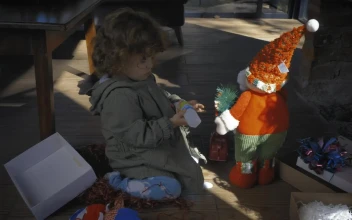 Stock Video Little Girl Playing With Gifts On Christmas Morning Animated Wallpaper