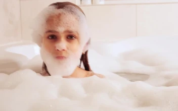 Stock Video Little Girl Playing With Foam In Her Bath Animated Wallpaper