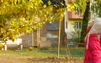 Stock Video Little Girl Playing In The Garden Animated Wallpaper