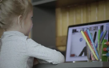 Stock Video Little Girl Paying Attention To Online Class Animated Wallpaper