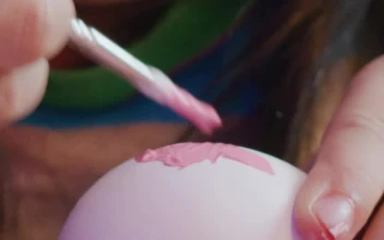 Stock Video Little Girl Paints Easter Eggs Close Up Animated Wallpaper
