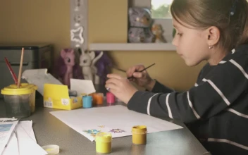 Stock Video Little Girl Painting On A Sheet At Home Animated Wallpaper