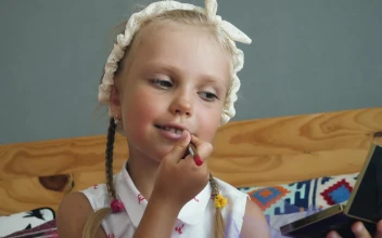 Stock Video Little Girl Painting Her Lips Animated Wallpaper