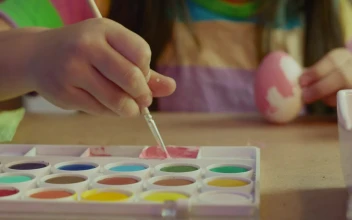 Stock Video Little Girl Painting An Egg With Pink Paint Animated Wallpaper