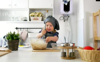 Stock Video Little Girl Making Cookie Mixture In The Kitchen Animated Wallpaper