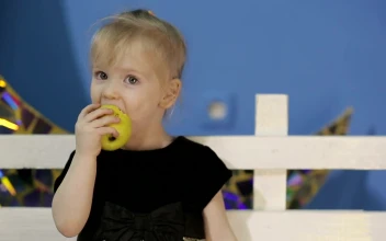 Stock Video Little Girl Healthy Eating An Apple Animated Wallpaper