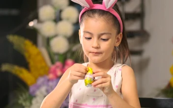 Stock Video Little Girl Eating An Easter Egg With Chocolate Animated Wallpaper
