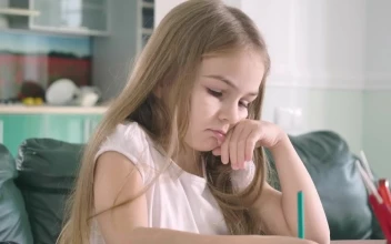 Stock Video Little Girl Doing Her Math Homework Animated Wallpaper