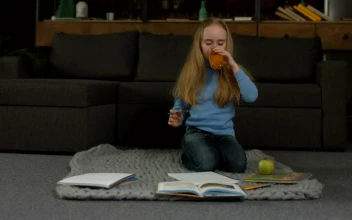 Stock Video Little Girl Doing Her Homework Animated Wallpaper