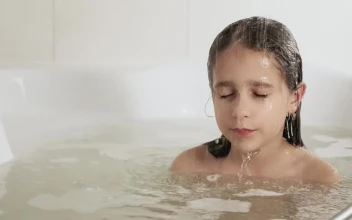 Stock Video Little Girl Dipping Her Hair In The Tub Animated Wallpaper
