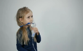 Stock Video Little Girl Breathing With Inhalation Device Animated Wallpaper