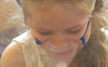 Stock Video Little Girl Breathing With A Facemask Animated Wallpaper
