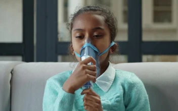 Stock Video Little Girl Breathing From The Mask Of A Vaporizer Animated Wallpaper
