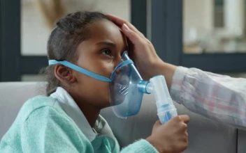 Stock Video Little Girl Breathing From A Nebulizer Animated Wallpaper