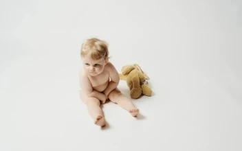 Stock Video Little Blonde Baby And A Plushie Animated Wallpaper