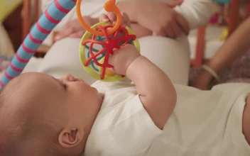 Stock Video Little Baby Playing With Toys In Bed Animated Wallpaper