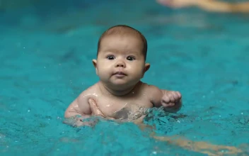 Stock Video Little Baby Learning To Swim In A Pool Animated Wallpaper
