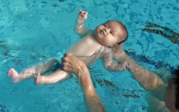 Stock Video Little Baby Learning To Float In The Pool Water Animated Wallpaper