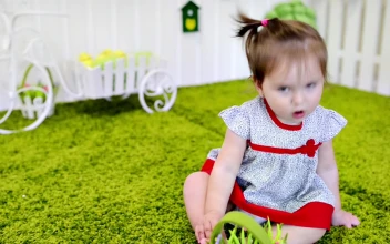 Stock Video Little Baby Girl Playing In The Garden Animated Wallpaper