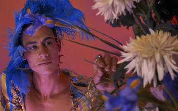 Stock Video Lgbtq Boy With Extravagant Clothes With Feathers And Flowers Animated Wallpaper