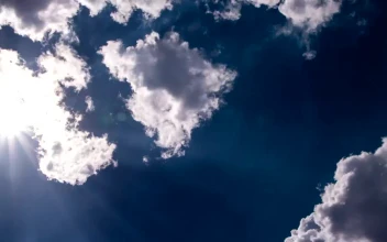Stock Video Lens Flare Through White Clouds Animated Wallpaper