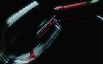 Stock Video Leaning Glass On A Black Background Filled With Red Wine Animated Wallpaper