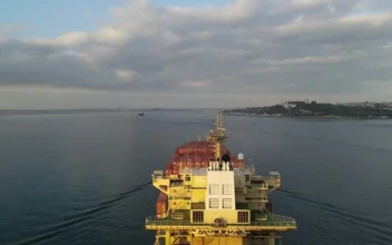 Stock Video Large Cargo Ship Sailing Away From A Port Smal Animated Wallpaper