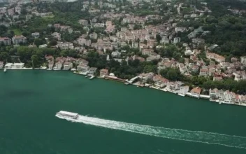 Stock Video Large Boat Heading By The Waterfront Smal Animated Wallpaper