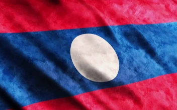 Stock Video Laos Flag With Faded Texture While Waving Animated Wallpaper