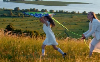Stock Video Mother With Her Daughter Running On The Field With Animated Wallpaper