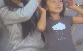 Stock Video Mother Trying On Christmas Hats With Her Little Daughte Animated Wallpaper