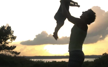 Stock Video Mother Throwing Her Son Upward Animated Wallpaper