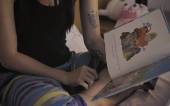 Stock Video Mother Reading A Book To Her Little Daughter Before Be Animated Wallpaper