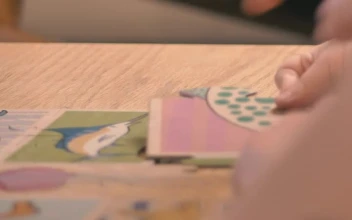 Stock Video Mother Puts Together A Puzzle With Her Daughte Animated Wallpaper