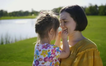 Stock Video Mother Kissing Her Young Child In Natur Animated Wallpaper