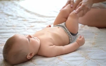 Stock Video Mother Exercising Her Babys Leg Animated Wallpaper